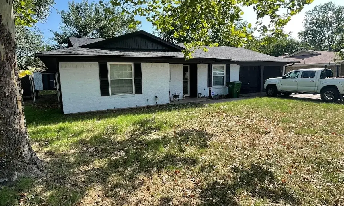Professional roofing crew working on a residential roof in Horsham